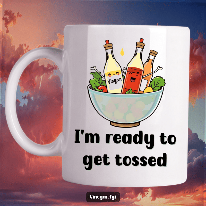 Add some fun to your morning with this whimsical mug. Featuring dancing vinegar bottles in a salad bowl.