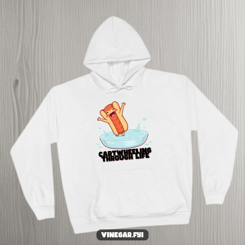 Funny hoodie: A delighted hot dog performs a cartwheel in a pool of vinegar, offering warmth and a dose of delightful, zesty humor.