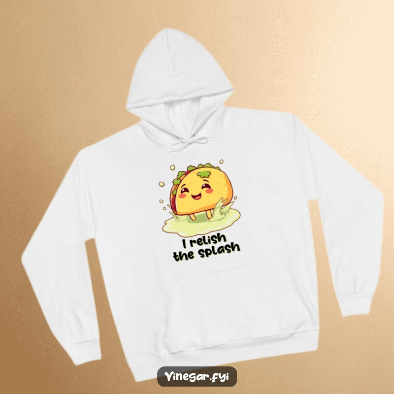 Funny hoodie: A smiling taco with legs joyfully splashes in a vinegar puddle, offering warmth and a hearty dose of food-related amusement.