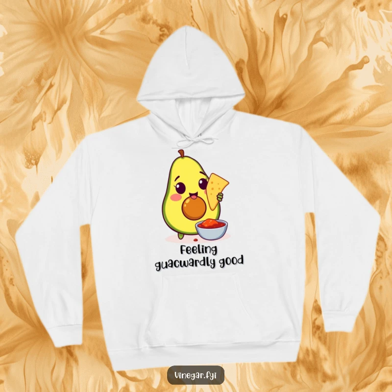 Funny hoodie depicting an amused avocado enthusiastically dipping a tortilla chip into salsa, perfect for cozy nights and snack cravings.