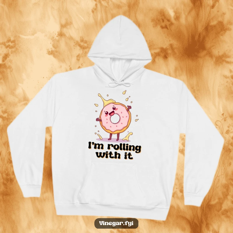 Funny donut hoodie showcasing a playful donut mid-cartwheel, near a vinegar splash, delivering a humorous and warm feeling.
