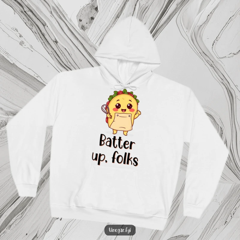 Funny Kawaii taco, apron-clad and smiling, energetically whisking batter on this warm and humorous chef hoodie. Cozy kitchen style.
