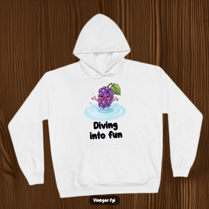 Funny hoodie showing a blushing purple grape with tiny arms excitedly splashing into a puddle of translucent fluid.