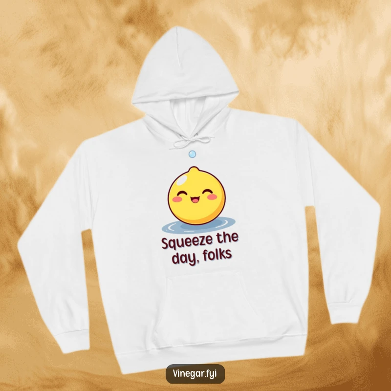 Funny round lemon character beaming as a tiny droplet bounces off its surface, featured on a soft and cheerful hoodie.
