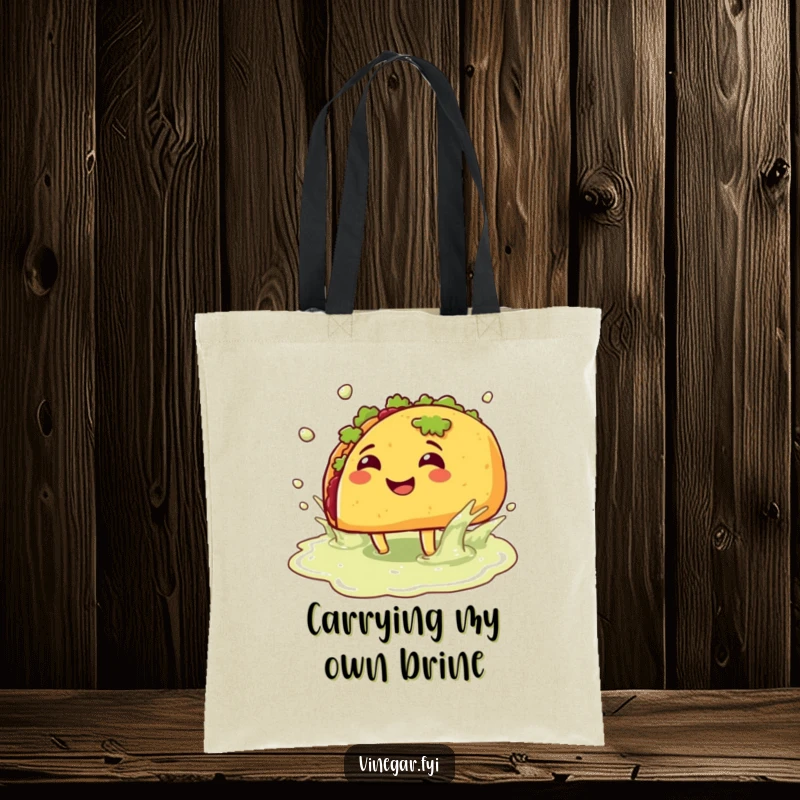Funny tote bag: A cheerful taco equipped with legs splashes playfully in a vinegar puddle, ideal for carrying groceries with a humorous flair.